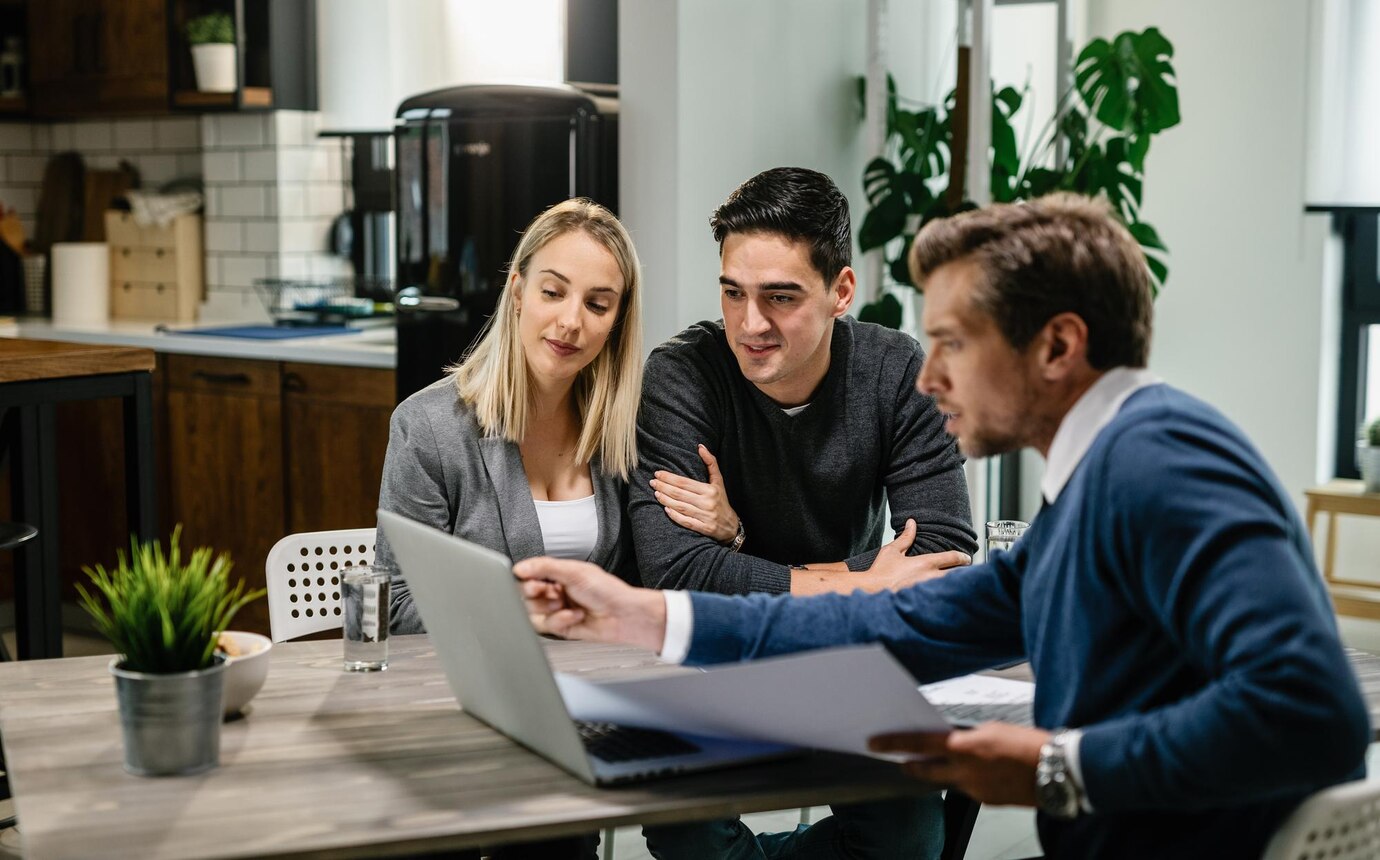 young couple real estate agent using laptop while going through housing plan meeting 637285 3857 | Blog
